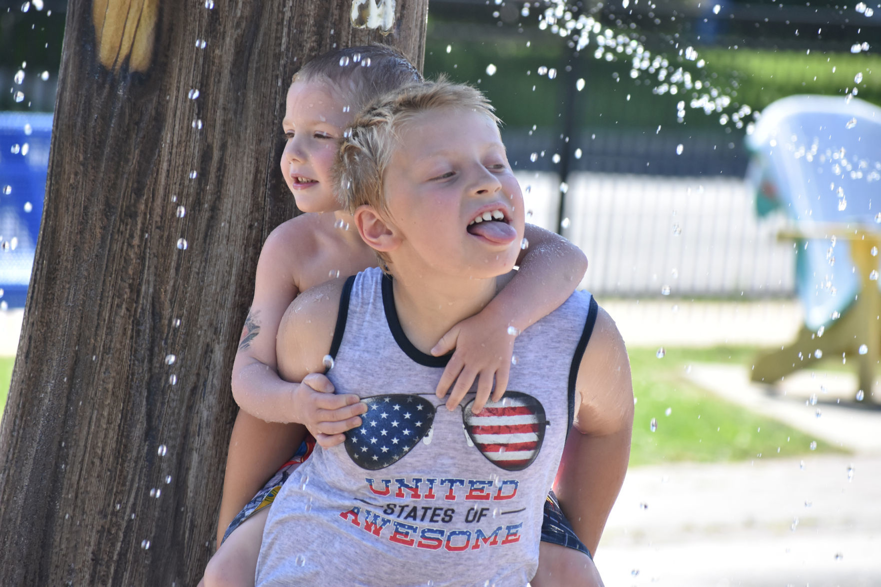Braydon and Greysun catch water droplets
